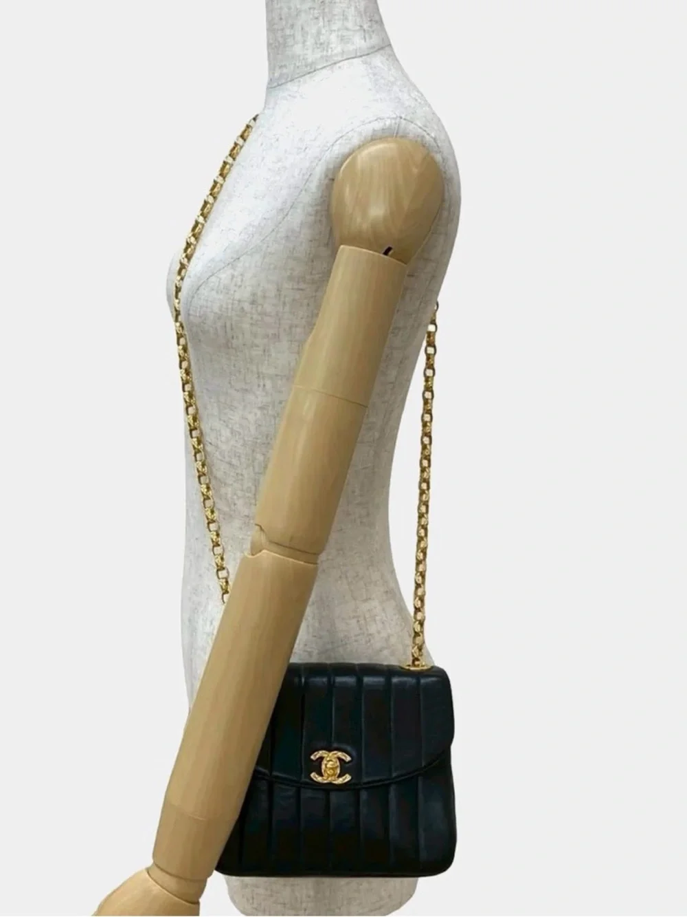 CHANEL Black Vertical Quilted Lambskin Shoulder Bag with Gold Hardware